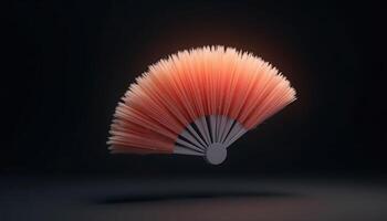 Hand Fan Prop in Peach and Gray Floating on a Dark Backdrop photo