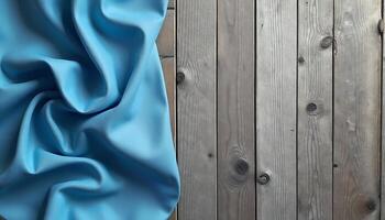 Light Blue Fabric Drapery on Rustic Wooden Planks for Backgrounds photo