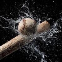 A baseball hitting a bat with water splashing photo