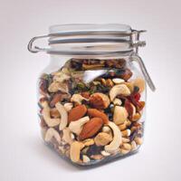 A jar filled with nuts and dried fruit photo