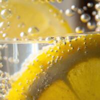 A close up of a lemon slice in a glass of water photo