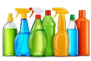 Cleaning products bottles standing in a row on white background photo