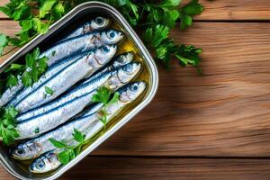 Sprats in olive oil with parsley garnished on rustic wooden table photo