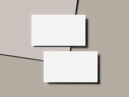 Vertical stack business card mockup on smooth neutral-toned background photo
