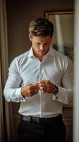 Groom Preparing for Wedding in Elegant Room During Afternoon Light photo