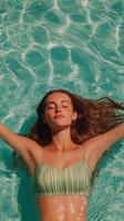 Woman Relaxing in Clear Blue Water of a Pool on a Sunny Day While Enjoying Peaceful Moments. photo