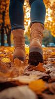 Autumn Walk Through Colorful Leaves Wearing Brown Boots in a Serene Forest. photo