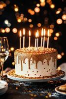 Birthday cake with candles and sprinkles photo