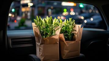 Fresh Green Plants in Paper Bags Ready for Home Delivery in Nighttime City Atmosphere photo