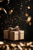 Golden gift box with confetti photo