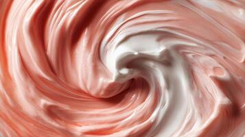 Swirling Mixture of Pink and White Cream in a Bowl During Preparation photo