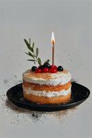 Beautifully Decorated Cake With Berries and Candle for Celebration photo