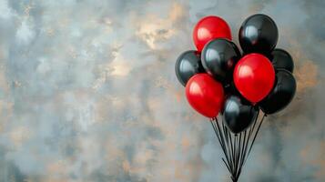Colorful Balloons in Red and Black Tied Together Against a Textured Backdrop in a Festive Atmosphere photo