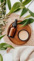Natural oils and cream on wooden tray photo