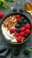 Yogurt bowl with berries and granola photo