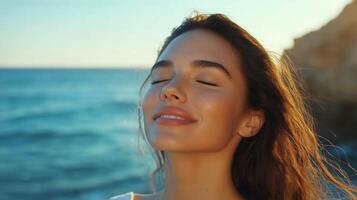 Captivating Sunset Moment by the Sea With a Relaxed Woman Enjoying the Warm Breeze. photo