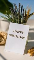 Birthday Card Placed in a Decorative Vase With Dried Flowers in a Natural Setting During Daylight Hours photo