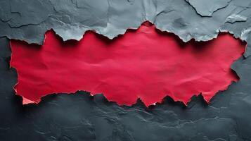 Torn Paper Revealing Vibrant Red Color With Textured Black Background in an Artistic Concept photo