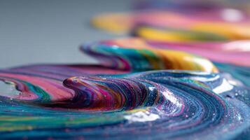 Macro shot of colorful, abstract paint waves with glitter particles. photo