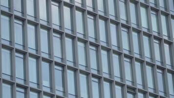 Modern building facade with repeating glass windows video