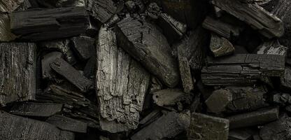 Charcoal Wood Pieces Close-Up Texture Background photo