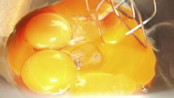 Mixing fresh eggs in a kitchen bowl for baking project video