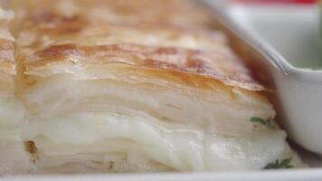 Layers of turkish borek with fresh herbs and vegetables video