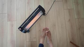 Keeping warm with a space heater on a chilly day video