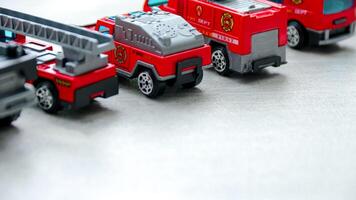 Toy Firetrucks in a Row Close Up photo