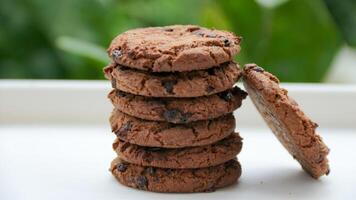 Stack of Chocolate Chip Cookies on White Surface Delicious Treat photo