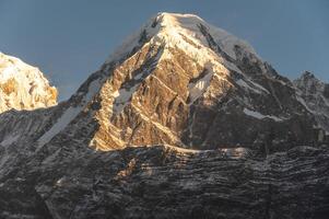 Beautiful view of Mt.Hiunchuli 6,441 m at dawn seen from Mardi Himal view point in the Annapurna region of Nepal. photo