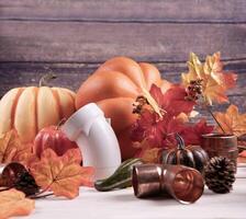 Happy Thanksgiving with construction tools, maple leaves and pumpkin on wood background. Autumn composition with copy space. photo