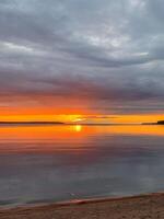Serene sunset ignites the tranquil lake sky, evoking Solstice reflections and World Water Days ethereal aquatic reverie photo