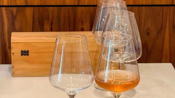 Crystal goblets bathed in amber hues, evoking Ardbeg Day elegance, sipping on Sunrise Toast during Tasmania Whisky Week photo
