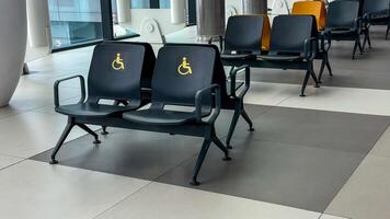 Reserved for universal accessibility, airport chairs whisper tranquility, echoing Equality Day and International Day of Persons with Disabilities photo
