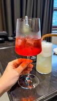Chilled scarlet elixir glistens in a glass, perfect for midsummer revelries or whimsical Lunar New Year toasts photo