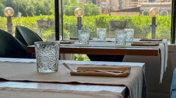 Elegant urban brunch setting with geometric glassware, capturing the serenity of a midsummer afternoon, perfect for Earth Day reflections photo
