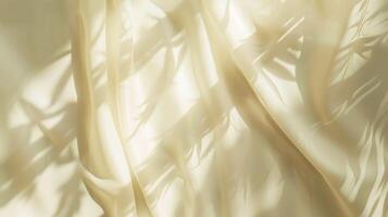 Golden silk fabric flows smoothly, a luxurious yellow textile with a soft, wavy pattern for elegant design backgrounds photo
