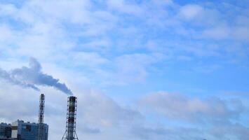 smoke from a red and white chimney. Air pollution photo