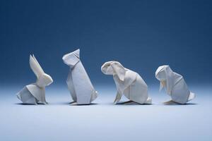 origami animal models arranged in minimalist setting, folded paper art, precise and clean design photo
