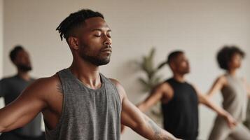Meditating man with closed eyes practicing yoga with diverse group in calm studio photo