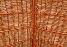 Rustic roof made of intertwined palm, hut or cabin. photo