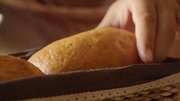 Freshly baked bread in a rustic basket setting video