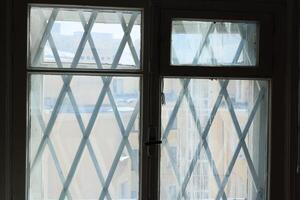 Exploring Geometric Window Design Featuring an Intricate Cross Pattern for Aesthetic Appeal photo