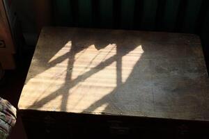Sunlight creates beautiful patterns on wood, enhancing its visual appeal and charm photo