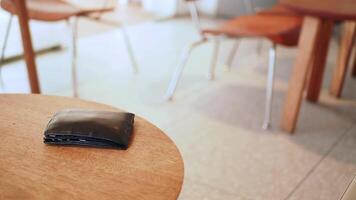 Wallet left on a table. lost wallet concept video