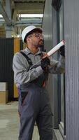 Construction worker applying sealant on window frame video