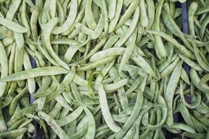 Fresh green beans displayed at a local market in summer photo