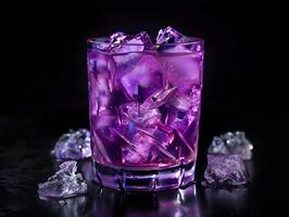 purple cocktail drink with large ice cubes in short glass on black background photo