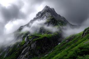 Mountain peak surrounded by lush greenery photo
